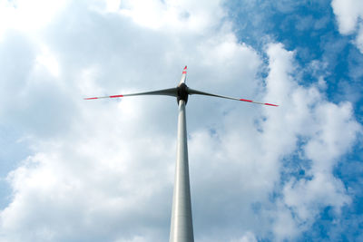 Low angle view of wind turbine against sky