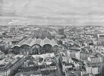 High angle shot of townscape against clouds