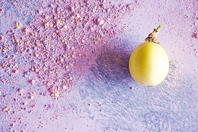 High angle view of passion fruit on chalk dusted floor