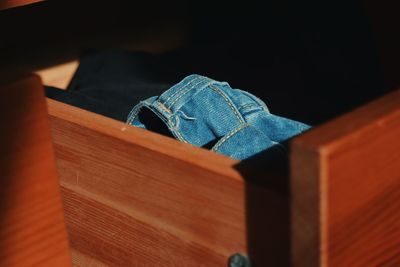 High angle view of jeans in drawer