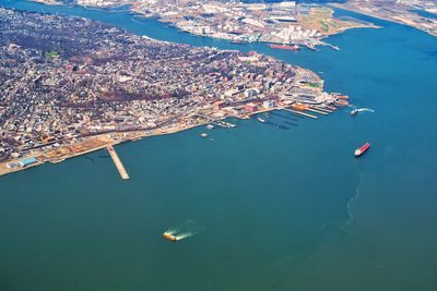 Aerial view of cityscape by sea