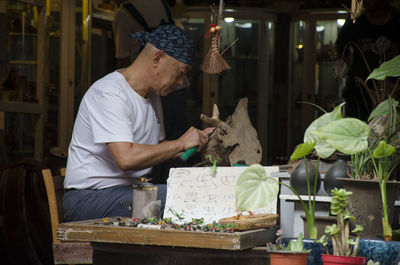 Man working at market stall