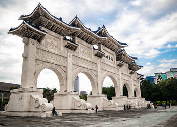 Group of people in front of historical building