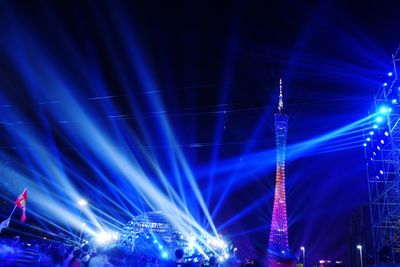 Illuminated tower during event at night