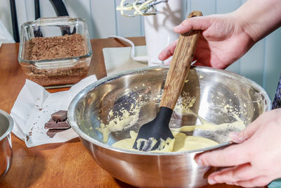 Midsection of woman preparing food in kitchen