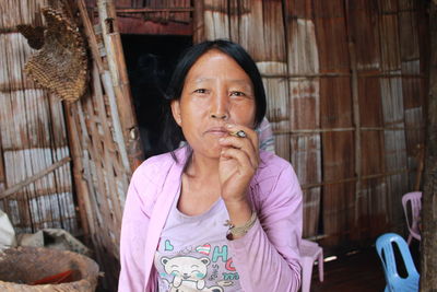 Portrait of mature woman smoking marijuana