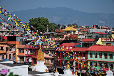 Cityscape of kathmandu, nepal from the roof restaurant with praying flags in front