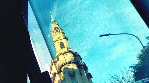 Low angle view of buildings against blue sky