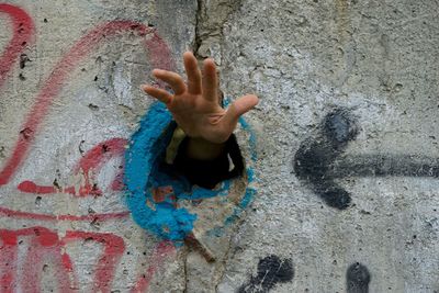 Close-up of boy on hand