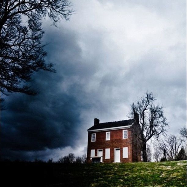 architecture, building exterior, built structure, sky, tree, cloud - sky, house, cloudy, bare tree, residential structure, cloud, overcast, residential building, field, outdoors, nature, day, grass, weather, low angle view