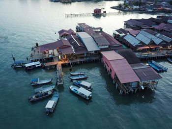 High angle view of boats moored at harbor