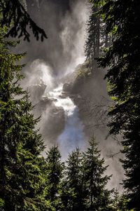 Low angle view of waterfall against sky