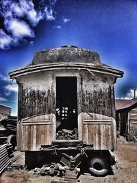 Low angle view of old building against blue sky