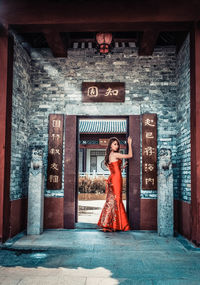 Woman standing in front of closed door