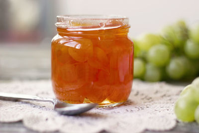 Close-up of drink in glass jar on table