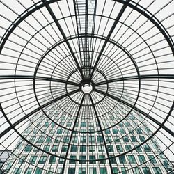 Skyscraper viewed through glass ceiling