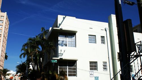 Low angle view of building against blue sky