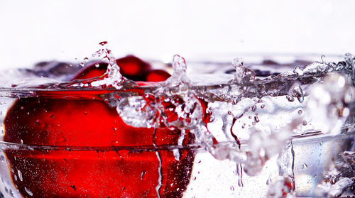 Close-up of apple in splashed water