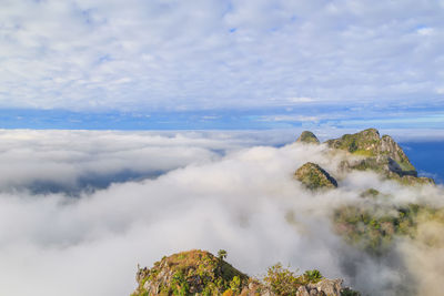 Low angle view of mountain against cloudy sky