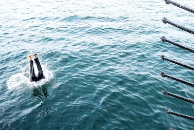 High angle view of man swimming in sea