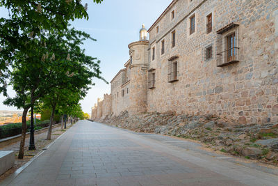 Street amidst buildings against sky