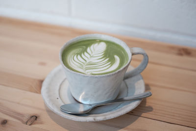 Close-up of coffee cup on table