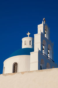 Dome and bell tower of the church of panagia platsani located in oia city at santorini island