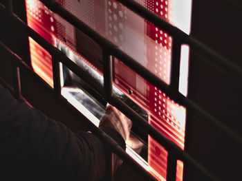 A man picking up a purchase at a vending machine