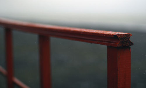 Close-up of wet railing