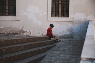 Boy standing on steps