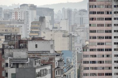 Buildings in city against sky