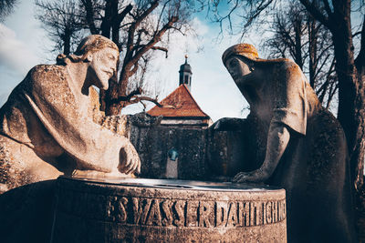 Low angle view of statue against sky