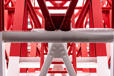 Pylon, red and white painted steel tower, fragments showing details of construction, joins, rivets.