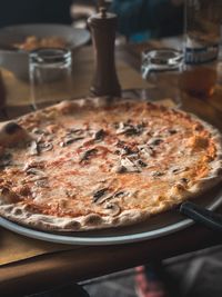 Close-up of pizza served on table