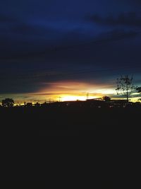 Silhouette landscape against sky during sunset