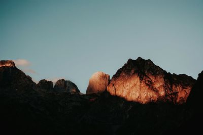 Low angle view of rock formations against sky