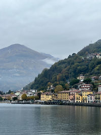 Scenic view of sea and mountains against sky