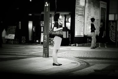 Full length of woman walking on wall