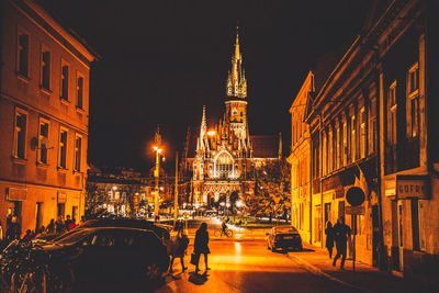 Low angle view of illuminated street at night