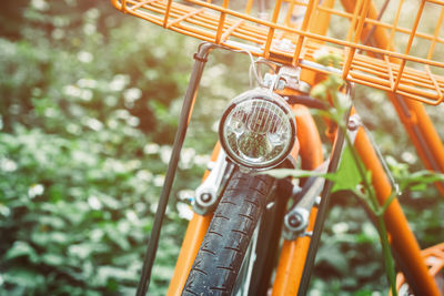 Close-up of bicycle against plants