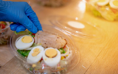 Close-up of person preparing food on table