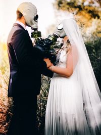 Midsection of woman holding umbrella