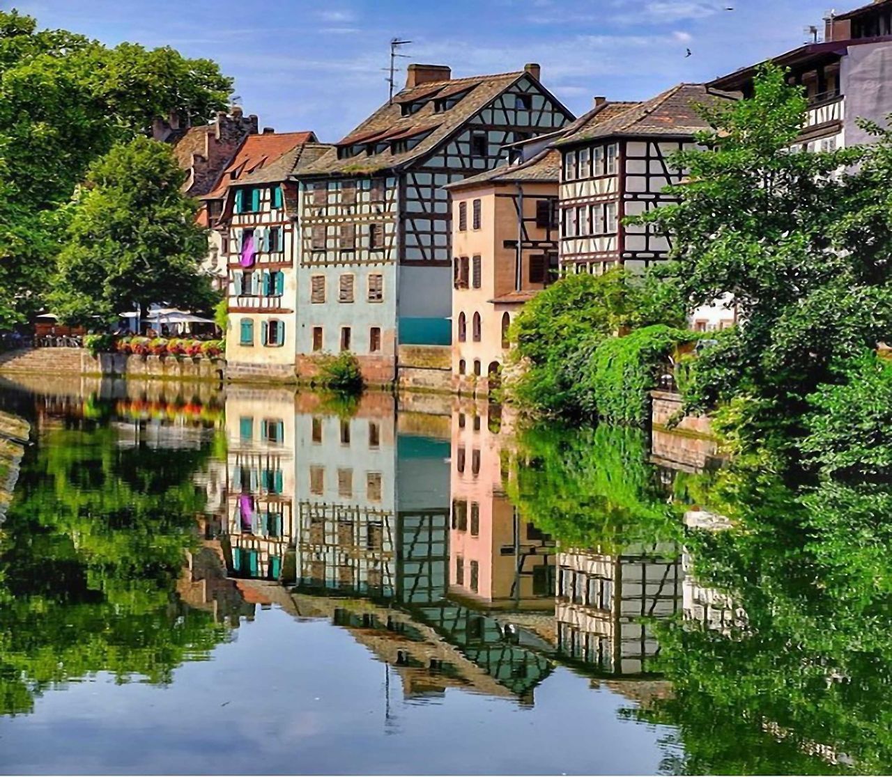 REFLECTION OF BUILDING IN LAKE