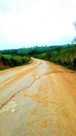 Road passing through field