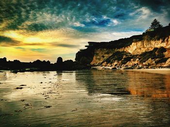 Scenic view of sea against cloudy sky