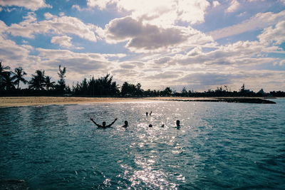 Scenic view of lake against cloudy sky