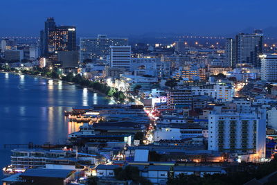 High angle view of illuminated buildings in city at night