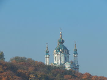 Low angle view of building against clear blue sky