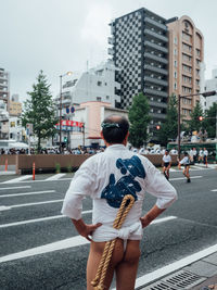 Rear view of woman on city street