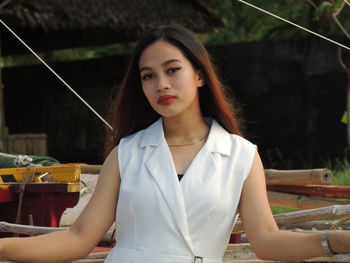 Portrait of young woman sitting at restaurant